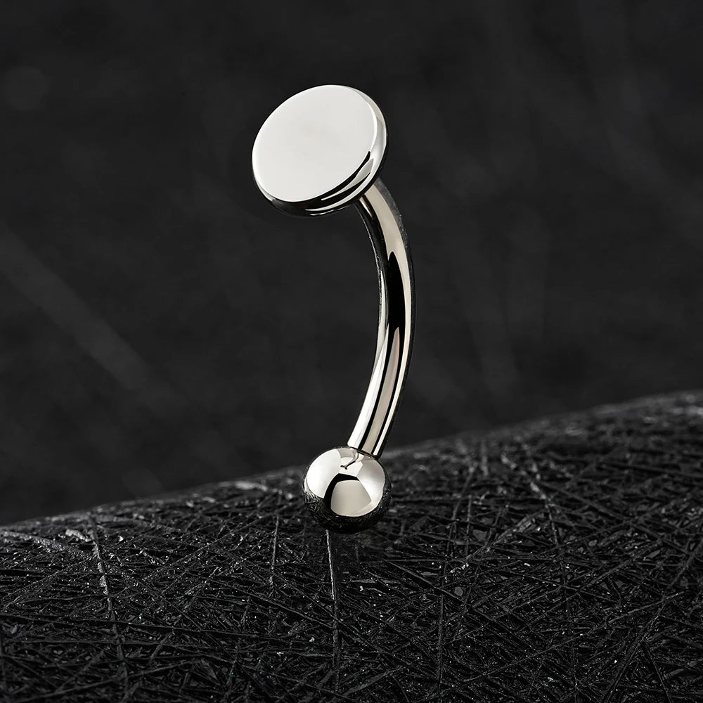 Rhino nose piercing with a flat disc a flat top titanium curved barbell
