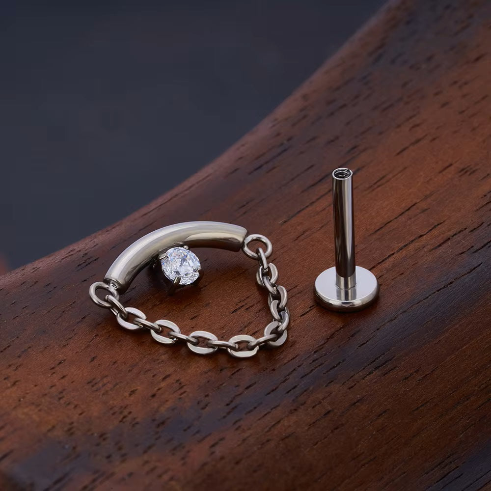 Floatung Helix Floating helix piercing stud with a curved bar a clear cz stone and a ...