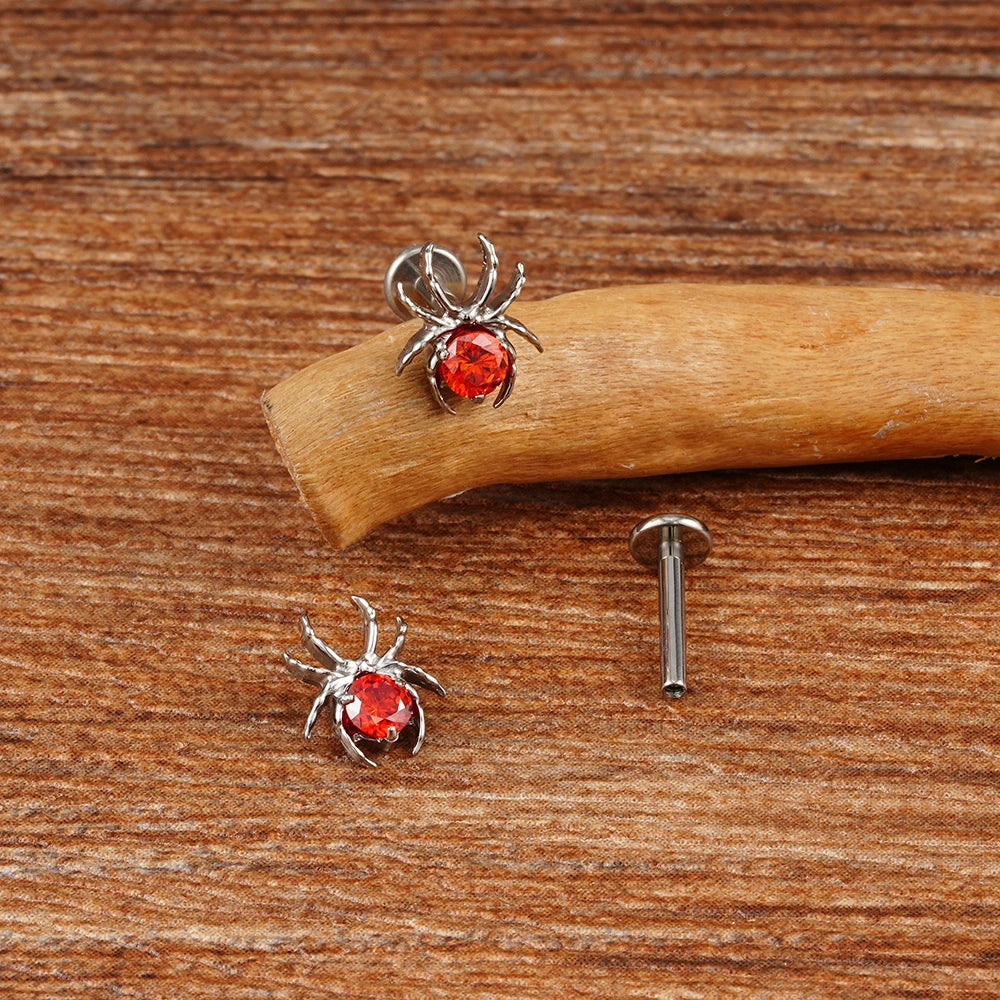 Piercing de araña con gema roja en plata negra y oro. Piercing de Halloween adecuado para oreja de titanio.