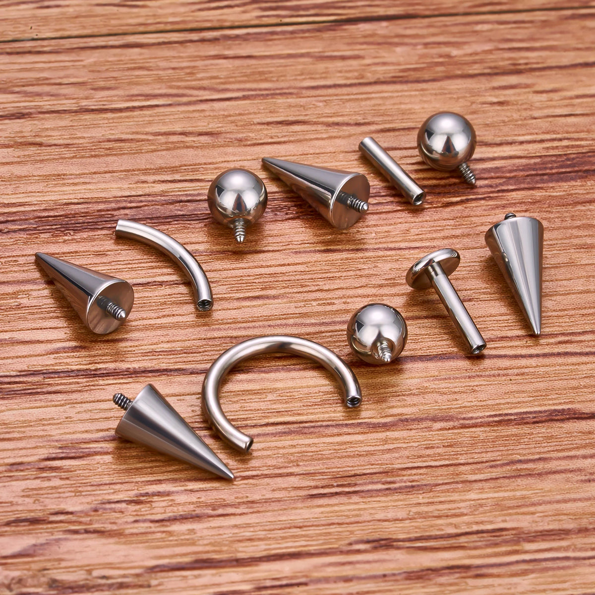 Vertical helix spike with one ball and one spike in silve titanium straight barbell 16G