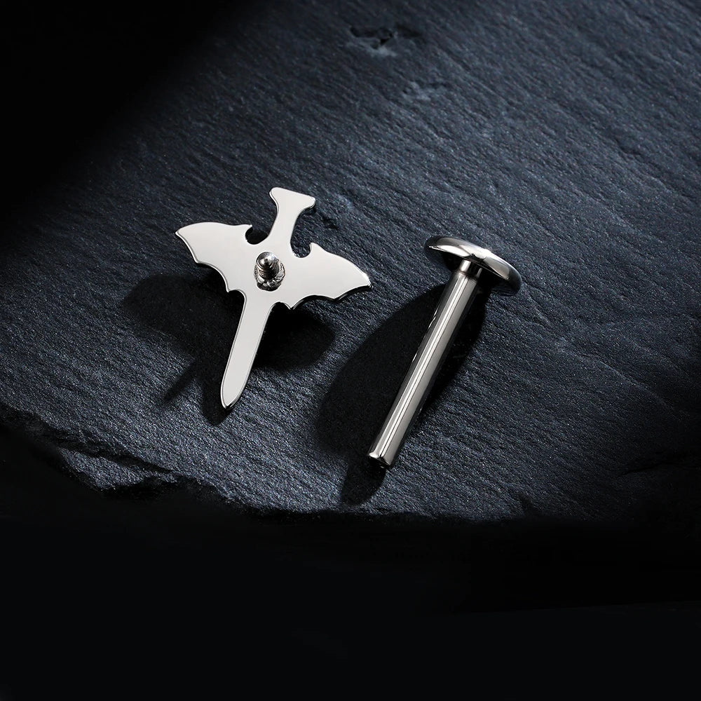Sword ear piercing with bat wings and a black stone titanium gothic cool halloween jewelry