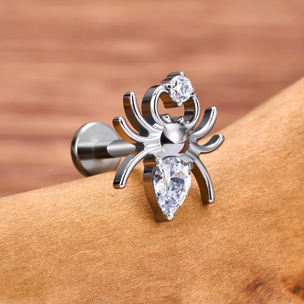 Spider nose stud with a clear pink or red diamond spider stud earring titanium piercing stud