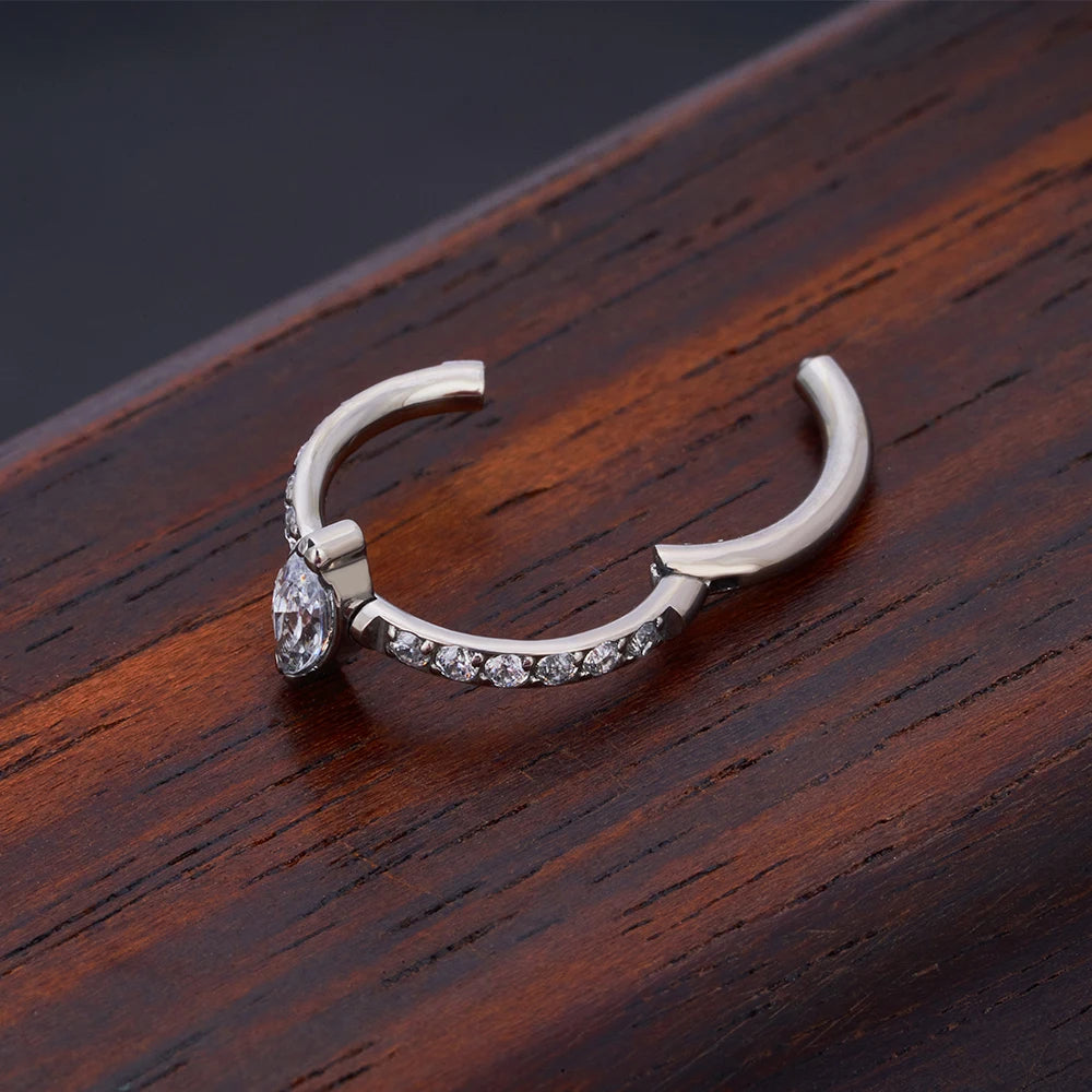 Snug piercing ring 16G titanium with marquise CZ stones hinged segment clicker
