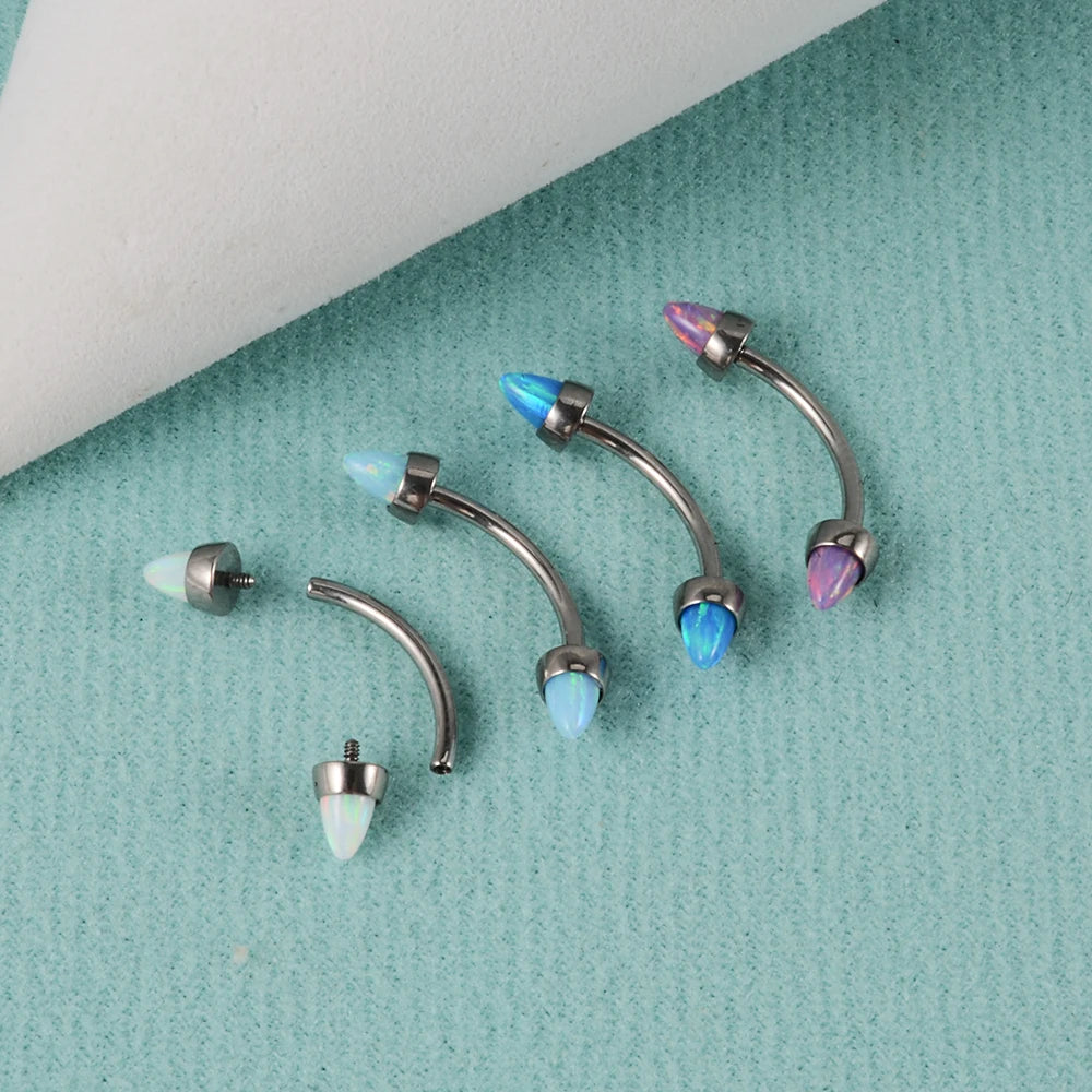 Spike eyebrow piercing with opal white blue purple titanium curved barbell