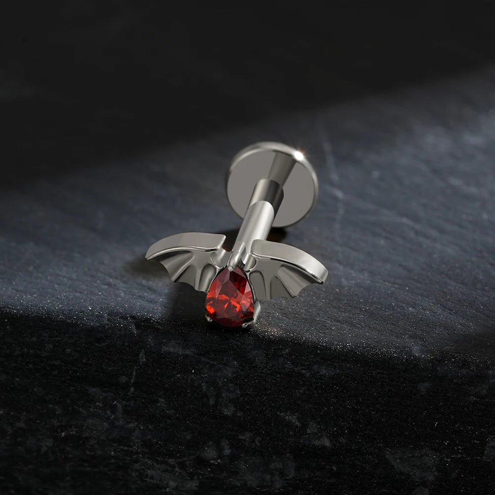 Bat helix piercing with a red stone titanium vampire piercing Halloween jewelry
