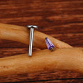 Unique diamond labret piercing with a trapezoid purple or clear cz stone titanium